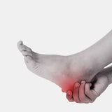A close-up of a human foot and ankle with a red pain indicator over the heel area, shown on a plain light gray background.