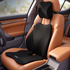 Three-piece black car seat cushion set including a lumbar support cushion, headrest pillow, and lower back cushion, shown installed on a tan leather car seat.