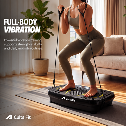 A woman in a gray sports bra and leggings stands on a Cults Fit vibration platform in a bright living room, pulling resistance bands with her hands. Large text on the left reads &